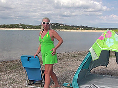 Mature blonde Beth enjoys solo play on the beach