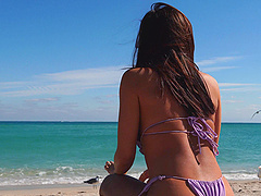Brunette bombshell in bikini teases in public