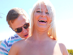 Fake tits and long hair meet in a steamy outdoor encounter