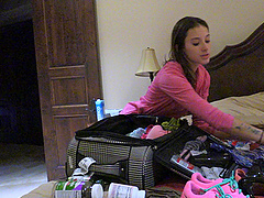 Slim brunette Roxanna shows off her skills in a public backstage solo session