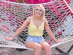 Sinclair enjoys playing with her big tits in the pool