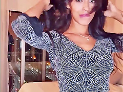 Brunette webcam goddess shows off her long hair while stripping down