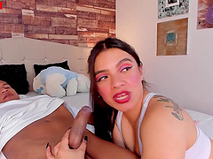 Tattooed brunette gives a handjob to her lover on webcam