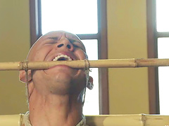 John Magnum gets bound and enjoys a dildo in his tight ass