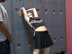 Brunette hottie gives a sloppy blowjob in the locker room