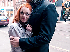 Redhead Ella Hughes gives her man a steamy blowjob in the kitchen