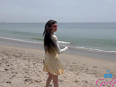 Tattooed brunette Angel Windell gets fucked on the beach