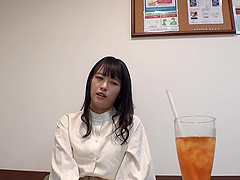 A girl in fishnets is having fun with a toy and vibrator