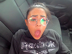 Clothed sex in a car gets wild with a long hair babe