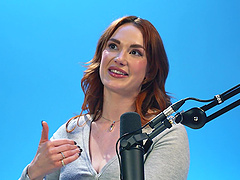 Redheaded beauty gets an orgasm with the help of her fingers.