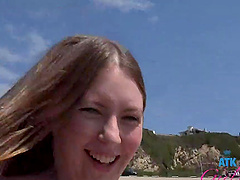 Beautiful brunette gets her pussy fingered in a car.