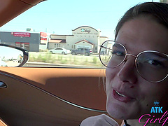 Beautiful woman with glasses Riley Rose has natural big boobs and wears a tattoo.