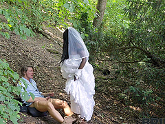 Long-haired beauty gets licked by her hot bride friend in the forest