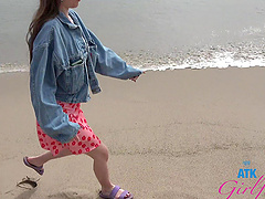 A brunette beauty with long hair gets it on in a car.