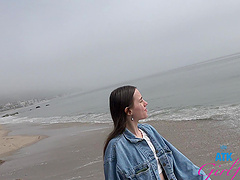 A brunette beauty with long hair gets it on in a car.