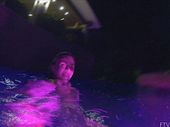 Beautiful brunette Lily swims alone in the pool and shows her natural beauty.