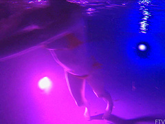 Beautiful brunette Lily swims alone in the pool and shows her natural beauty.