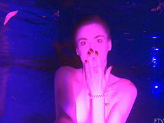 Beautiful brunette Lily swims alone in the pool and shows her natural beauty.