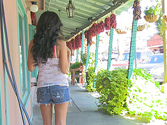 Ariane’s long hair falls on her shoulders as she pleases herself.