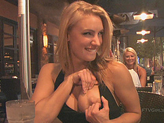 Anne is a blonde beauty who reveals her big boobs in public.