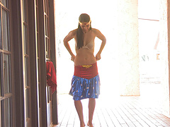 Real-life beauty with natural tits, wearing a costume, masturbates.