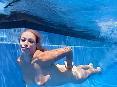 Beautiful milf Lory Lace has an underwater pool sex with a young and hung stud.