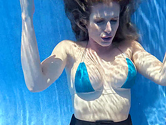 Beautiful milf Lory Lace has an underwater pool sex with a young and hung stud.