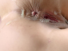 Beautiful woman with natural breasts having sex on the bed.