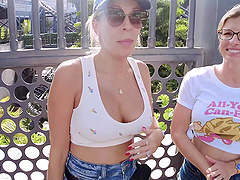 Two milfs are getting fucked outdoors by a young guy