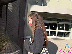 Beautiful woman with long hair seduces her lover in the car.