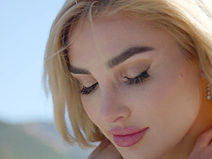 Beautiful woman with long hair and curvaceous body wears a thong under her miniskirt.