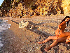 A beautiful couple enjoys hot sex on the beach.