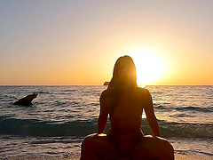 A beautiful couple enjoys hot sex on the beach.