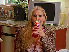 Julia Ann's long hair falls on her shoulders while she is being fucked in the ass.
