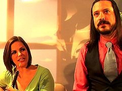 Beautiful women with amazing assets pose in the middle of the set.