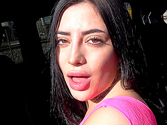 Beautiful long-haired woman gives a blowjob in a car.