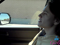 Beautiful woman with glasses has sex in her car