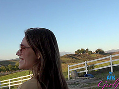 Beautiful woman with glasses has sex in her car