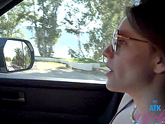 Beautiful woman with glasses has sex in her car