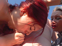 Molly Lee, along with another woman, share an intense outdoor threesome experience.