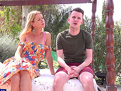 A couple enjoying a passionate outdoor moment with a blonde