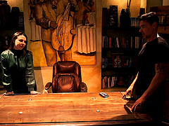 Two girls share a big cock in an intense threesome scene.