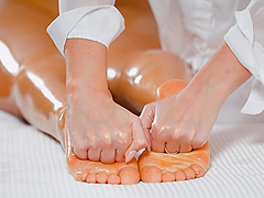 Kaisa Nord and Marchy Rock in sensual lesbian massage with oily pussy fingering.