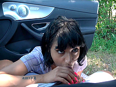 Girlfriends Candy Scott have fun in the car without underwear