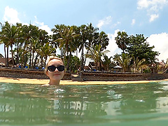 Lovita Fate, sexy angel in bikini by the pool