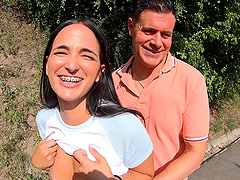 A guy fucks his girl with a big cock outdoors, featuring Claudia Bavel’s stunning curves.