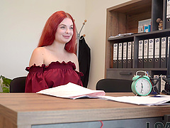 An office encounter with a stunning redhead and her impressive curves
