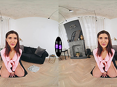 A long-haired brunette plays with her natural tits