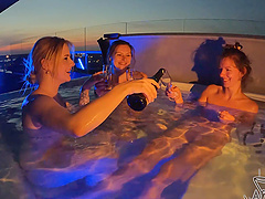 Two beautiful girls are having fun in the pool without any clothes
