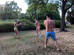 Two girls and a guy have fun together in a steamy outdoor scene